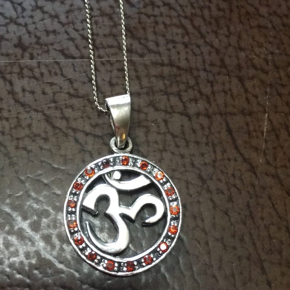 Sterling silver Om pendant red garnet and cz